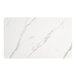 A white rectangular table top with white marble and black veins.
