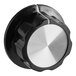 A black and white knob with a silver circle.