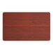 A rectangular Lancaster Table & Seating wood table top with a red mahogany finish.