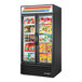 A black True glass door merchandiser freezer with a variety of products inside.