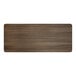 A rectangular wooden surface with a dark brown finish.