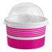 A pink and white paper frozen yogurt container with a clear dome lid.