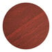 A Lancaster Table & Seating round wooden table top with a red mahogany finish.