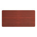 A Lancaster Table & Seating rectangular wooden table top with a red mahogany finish.