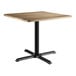 A Lancaster Table & Seating square table with a gray wood top and black base.