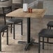 A Lancaster Table & Seating rectangular table with a gray wood finish.