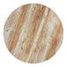 A Lancaster Table & Seating round wood table top with a barnwood finish.