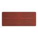 A rectangular wooden table top with a red mahogany finish.