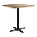 A Lancaster Table & Seating square table with a gray wood finish and black base.