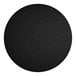 A black circular table top with a white object in the middle.