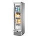 A True one section glass door reach-in refrigerator full of dairy products.