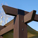 A Paragon Outdoor espresso aluminum pergola with a mocha retractable canopy.