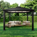 A black Paragon Outdoor Santa Monica gazebo with a table and chairs on grass.