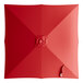 A red square umbrella canopy with a white circle in the center.