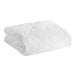 A close-up of a white Oxford mattress pad.