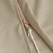 A beige polyester umbrella cover with a zipper.
