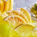 A close up of two drinks with Mixologist's Garden freeze-dried lemon slices.