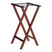 A Lancaster Table & Seating mahogany wood folding tray stand with black straps.