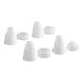 A set of four white plastic Wilton couplers.