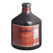A bottle of Guittard Sweet Ground Dark Chocolate Flavoring Sauce on a white background.