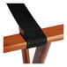 A black strap on a Lancaster Table & Seating wooden folding tray stand.