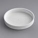 A white plastic lid with a ribbed top.