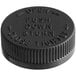 A black plastic child resistant cap with foam liner and instruction text.