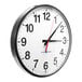 A Pyramid TimeTrax Sync analog clock with a white face and black numbers.