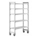 A white plastic Cambro Camshelving Premium mobile shelving unit with 5 shelves and wheels.