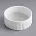 A 38/400 white plastic child resistant bottle cap with a heat induction liner.