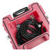 A black cable in a pink PURAERO power distribution box.