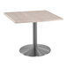 A Holland Bar Stool white ash square table with a stainless steel base.