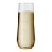 A close up of a Tossware plastic champagne flute filled with champagne and bubbles.