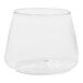 A clear Tossware plastic rocks glass with a round bottom on a white background.