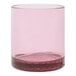 A Tossware Blush Tritan plastic rocks glass with a rim.
