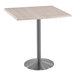 A Holland Bar Stool white ash square table with a stainless steel base.