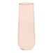 A clear Tossware POP coral pink flute glass.