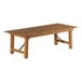 A Lancaster Table & Seating Vineyard Series outdoor folding table with a wooden top and metal legs.