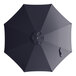 A black circular umbrella canopy with a white Lancaster Table & Seating logo.