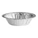 A silver foil tart pan with a white background.