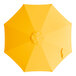 A yellow umbrella with a hole in the top.
