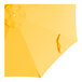 A yellow umbrella canopy with a white circle on top.