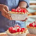 A woman holding a Baker's Lane foil pie.