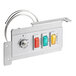 A metal panel with three switches and a light.
