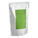 A white bag with a green and white label.