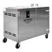 A stainless steel Pro Smoker pellet smoke generator with wheels.