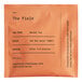 A box of 50 orange and black Dona The Field Herbal Tea sachets.