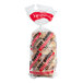 A plastic bag of Just Bagels Authentic New York Multigrain Bagels with a red label.