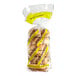 A bag of Just Bagels plain bagels in a plastic bag with yellow writing.