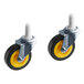 A pair of black and yellow Lavex caster wheels with yellow rubber.